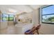 Well-equipped kitchen with white cabinets and breakfast bar at 826 Bayport Way # 826, Longboat Key, FL 34228