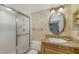 Updated bathroom with granite vanity and glass shower at 826 Bayport Way # 826, Longboat Key, FL 34228