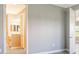 Bathroom view shows large mirror, double vanity, wood cabinetry, and light fixtures at 109 Corserra Dr, Nokomis, FL 34275