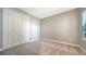 Bedroom features plush carpet, window for natural light, closet and neutral paint at 109 Corserra Dr, Nokomis, FL 34275