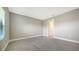Neutral bedroom with tile floor, natural light and a doorway to another room at 109 Corserra Dr, Nokomis, FL 34275