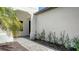 Home entryway featuring a brick pathway and manicured landscaping at 109 Corserra Dr, Nokomis, FL 34275