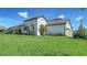 Single Gathering home with lush green grass, landscape, a two-car garage and tile roof at 109 Corserra Dr, Nokomis, FL 34275