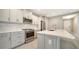 Modern kitchen features stainless steel appliances, a center island, and stylish cabinetry at 109 Corserra Dr, Nokomis, FL 34275