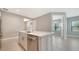 Kitchen island has sink with stainless steel dishwasher at 109 Corserra Dr, Nokomis, FL 34275