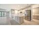 Updated kitchen features a center island, stainless steel appliances, and ample cabinet space at 109 Corserra Dr, Nokomis, FL 34275