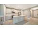 Modern kitchen features stainless steel appliances, a center island, and stylish cabinetry at 109 Corserra Dr, Nokomis, FL 34275