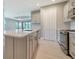 Kitchen with stainless steel appliances and a center island at 109 Corserra Dr, Nokomis, FL 34275