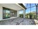 Outdoor lanai featuring sliding glass doors to the interior and screened in view of the backyard at 109 Corserra Dr, Nokomis, FL 34275