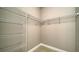Walk-in closet with tile flooring and metal shelving for optimal organization at 109 Corserra Dr, Nokomis, FL 34275