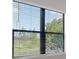 Window with view of lawn, trees and blinds at 109 Corserra Dr, Nokomis, FL 34275