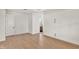 Bright bedroom with hardwood floors and access to bathroom at 12926 Pinnacle Ln, Venice, FL 34293