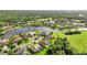 Aerial view of upscale community with lake and golf course at 13791 Palmetto Point Ct, Port Charlotte, FL 33953
