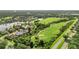 Aerial view of golf course and lakefront homes at 13791 Palmetto Point Ct, Port Charlotte, FL 33953