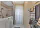Walk-in shower, walk-in tub, and linen closet in bathroom at 13791 Palmetto Point Ct, Port Charlotte, FL 33953