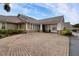 Community clubhouse with brick facade and covered entrance at 13791 Palmetto Point Ct, Port Charlotte, FL 33953