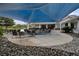 Relaxing community patio with shade structure and seating at 13791 Palmetto Point Ct, Port Charlotte, FL 33953