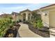 Inviting front entrance with a charming walkway, manicured landscaping, and a warm, welcoming ambiance at 13791 Palmetto Point Ct, Port Charlotte, FL 33953