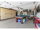 Finished garage with pool table and storage at 13791 Palmetto Point Ct, Port Charlotte, FL 33953