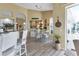 Kitchen nook with a glass table and seating for four, overlooking the pool at 13791 Palmetto Point Ct, Port Charlotte, FL 33953