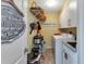 Laundry room with washer, dryer, utility sink, and storage at 13791 Palmetto Point Ct, Port Charlotte, FL 33953