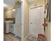 Laundry room features cabinets, folding counter, and access to the garage at 13791 Palmetto Point Ct, Port Charlotte, FL 33953