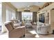 Bright living room featuring vaulted ceilings, neutral decor and built-in shelving at 13791 Palmetto Point Ct, Port Charlotte, FL 33953