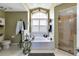 Bright bathroom features garden tub, and glass enclosed shower at 13791 Palmetto Point Ct, Port Charlotte, FL 33953