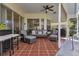 Covered patio with seating area and grill at 13791 Palmetto Point Ct, Port Charlotte, FL 33953
