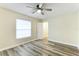 Bedroom with wood-look floors and ceiling fan at 1535 Bay Hill Cir, Sarasota, FL 34232