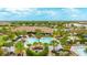 Aerial view of resort-style pool with lounge chairs and cabanas at 5227 Morey Farms Loop, Palmetto, FL 34221