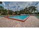 Inviting community pool with plenty of lounge chairs for sunbathing at 4525 46Th Street W Ct # 201B, Bradenton, FL 34210