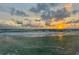 Peaceful sunrise over the ocean with calm waves at 769 North Shore Dr, Anna Maria, FL 34216