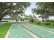 Shuffleboard courts surrounded by lush landscaping and trees at 304 47Th Avenue W Dr # 307, Bradenton, FL 34207