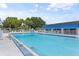 Community pool surrounded by a fence at 304 47Th Avenue W Dr # 307, Bradenton, FL 34207