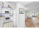 White kitchen with granite countertops and stainless steel appliances at 304 47Th Avenue W Dr # 307, Bradenton, FL 34207