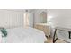 Cozy bedroom with comfortable bed, dresser, and vanity at 304 47Th Avenue W Dr # 307, Bradenton, FL 34207