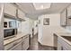 Galley-style kitchen with granite counters and stainless steel appliances at 5026 Water Oak Dr # 112, Bradenton, FL 34207