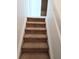 Carpeted staircase leading to the second floor at 6209 Flagfish Ct, Lakewood Ranch, FL 34202
