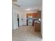 Kitchen with wood cabinets and tiled floors at 6209 Flagfish Ct, Lakewood Ranch, FL 34202