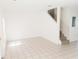Spacious living room with tile floors and a staircase at 6209 Flagfish Ct, Lakewood Ranch, FL 34202