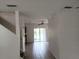 Bright living room with tile floors and access to the backyard at 6209 Flagfish Ct, Lakewood Ranch, FL 34202