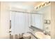 Clean bathroom with a shower/tub combo, toilet and vanity at 5924 40Th W Ave, Bradenton, FL 34209