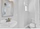 Small bathroom with pedestal sink and toilet at 21306 Hepner Ave, Port Charlotte, FL 33952