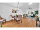 Bright dining area with wood floors and modern chandelier at 4740 Marsh Field Rd # 6, Sarasota, FL 34235