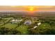 Wide aerial showcasing a luxurious property with a pool and large lot at 9060 Swaying Branch Rd, Sarasota, FL 34241