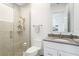 Modern bathroom with walk-in shower and gray tile at 9060 Swaying Branch Rd, Sarasota, FL 34241