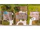 From above see a home with an open yard, paver drive, mature landscaping, and a nearby pool at 2232 River Ridge Dr, Sarasota, FL 34239