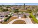An aerial view of the home with a circular driveway and a lush, landscaped yard at 2232 River Ridge Dr, Sarasota, FL 34239