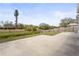 Concrete patio overlooking a peaceful canal, providing a serene outdoor space at 2232 River Ridge Dr, Sarasota, FL 34239